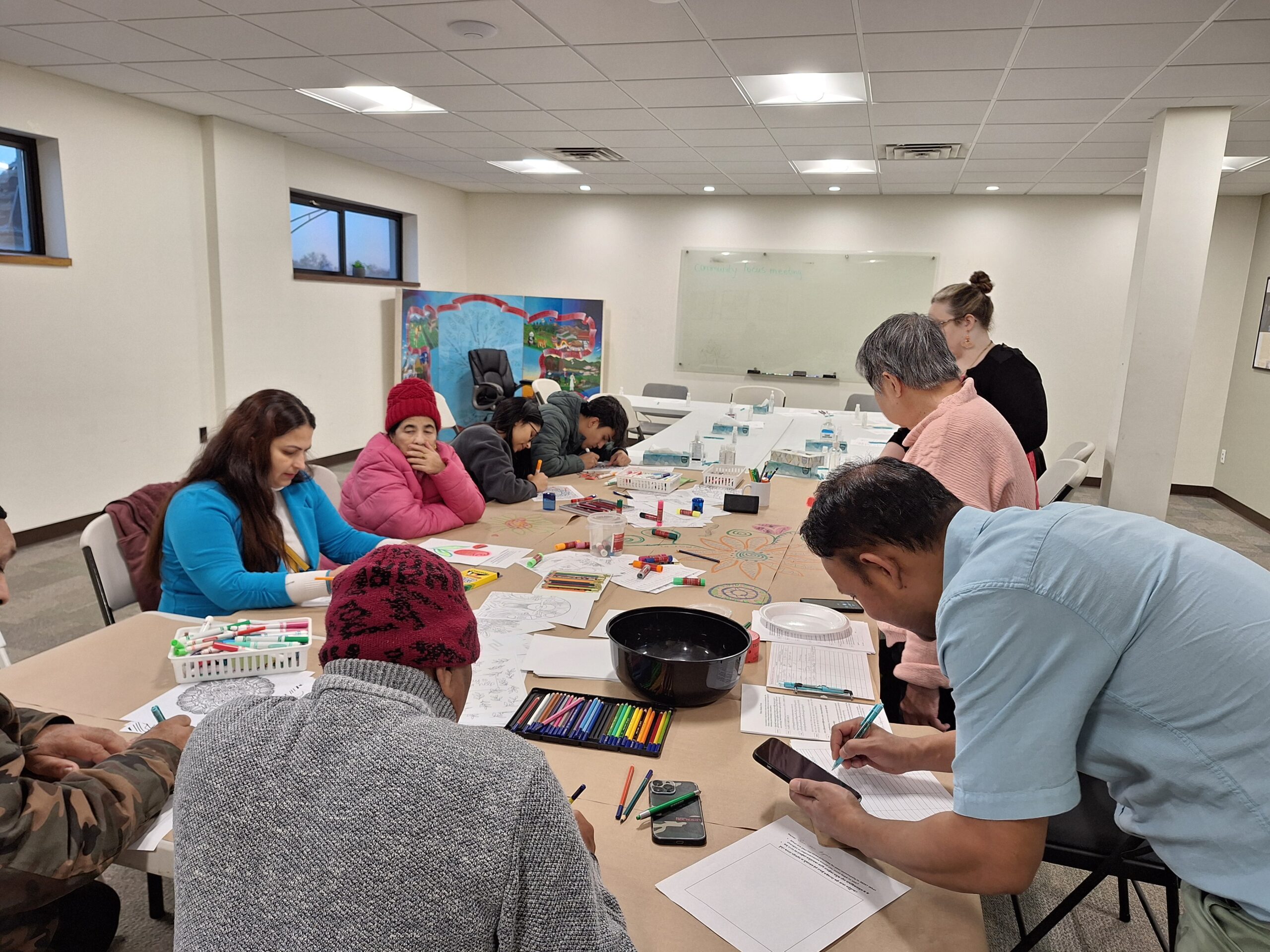 Bhutanese-Nepali community members participate in art therapy before the group discussion in December 2024