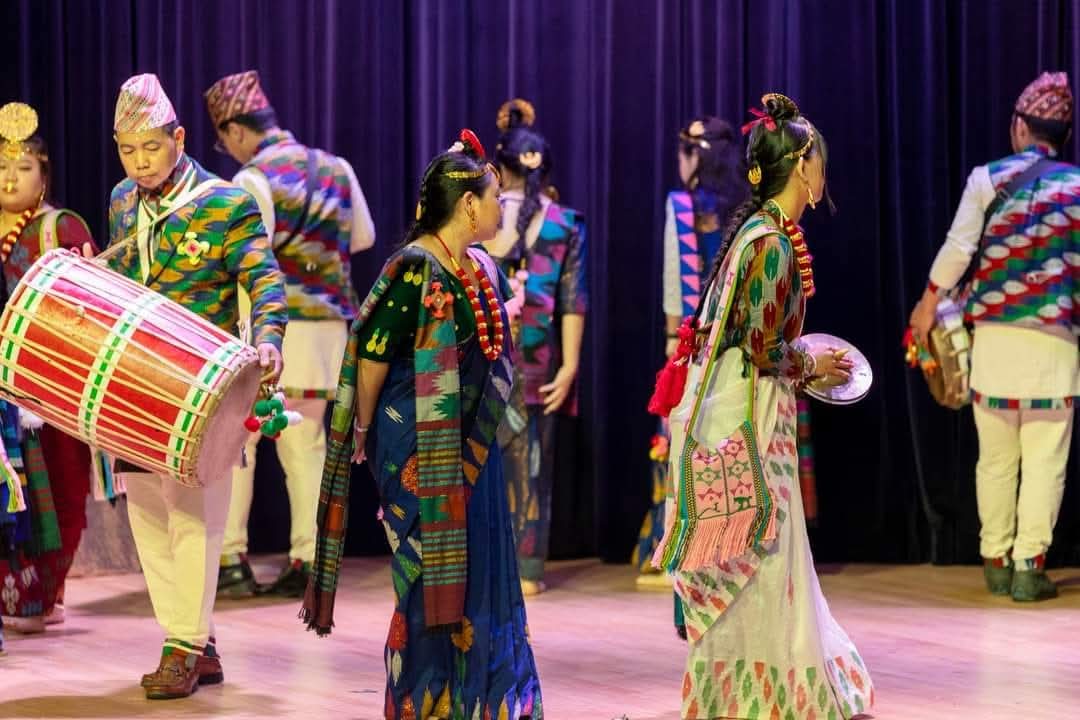 1000000671 Limbu cultural celebration in Akron, Ohio. The woven patterns on the women's clothes are examples of dhaka, a traditional weaving technique specific to Limbu culture.
