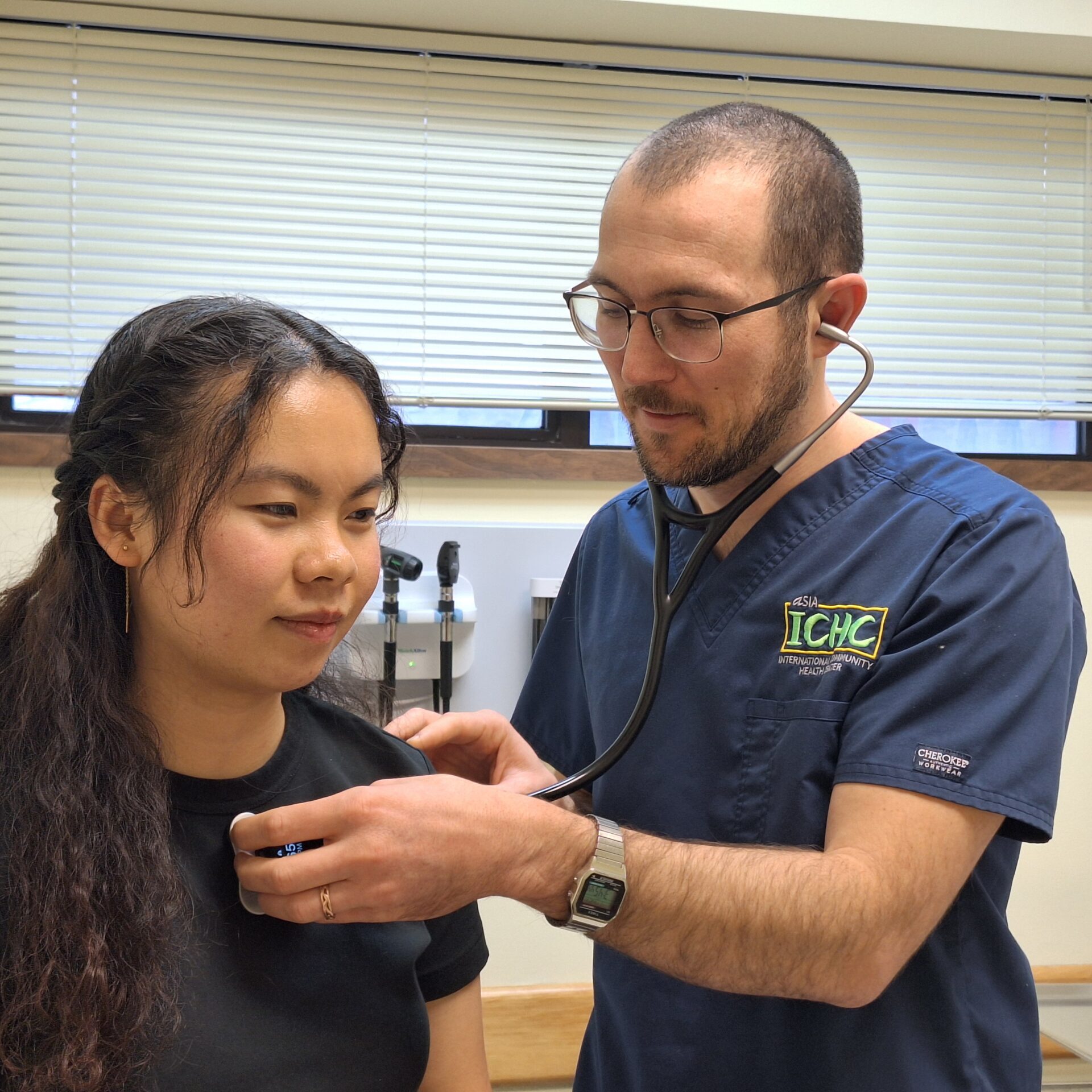 Clinic provider performs routine checkup on a patient